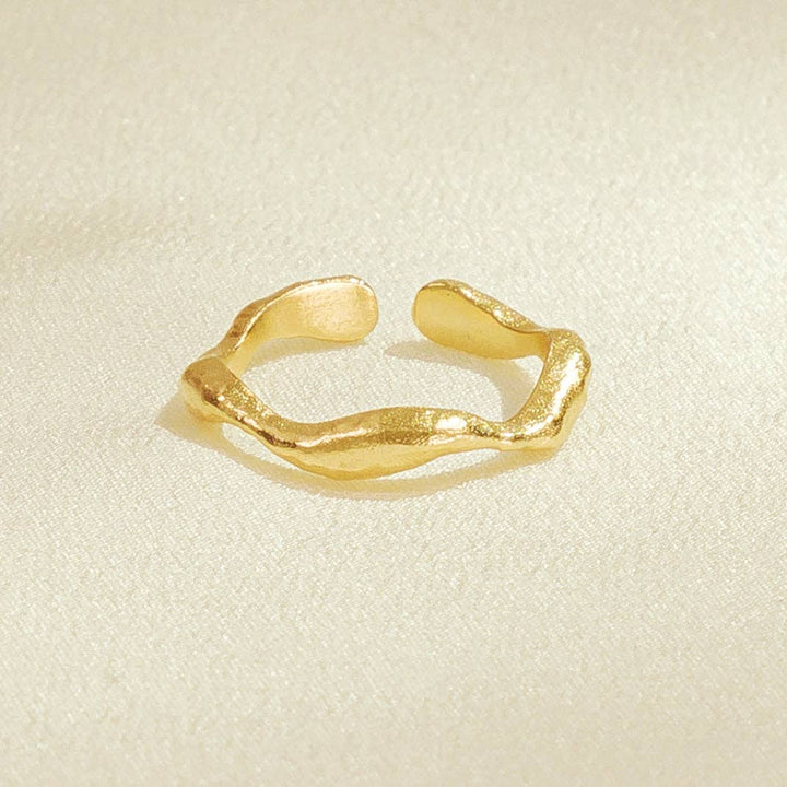 gold curved shape ring